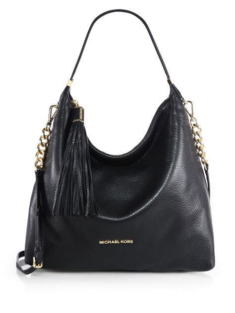 black and neon michael kors purse|michael kors black shoulder handbags.